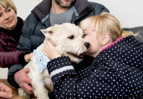 Dog with girl saying good bye